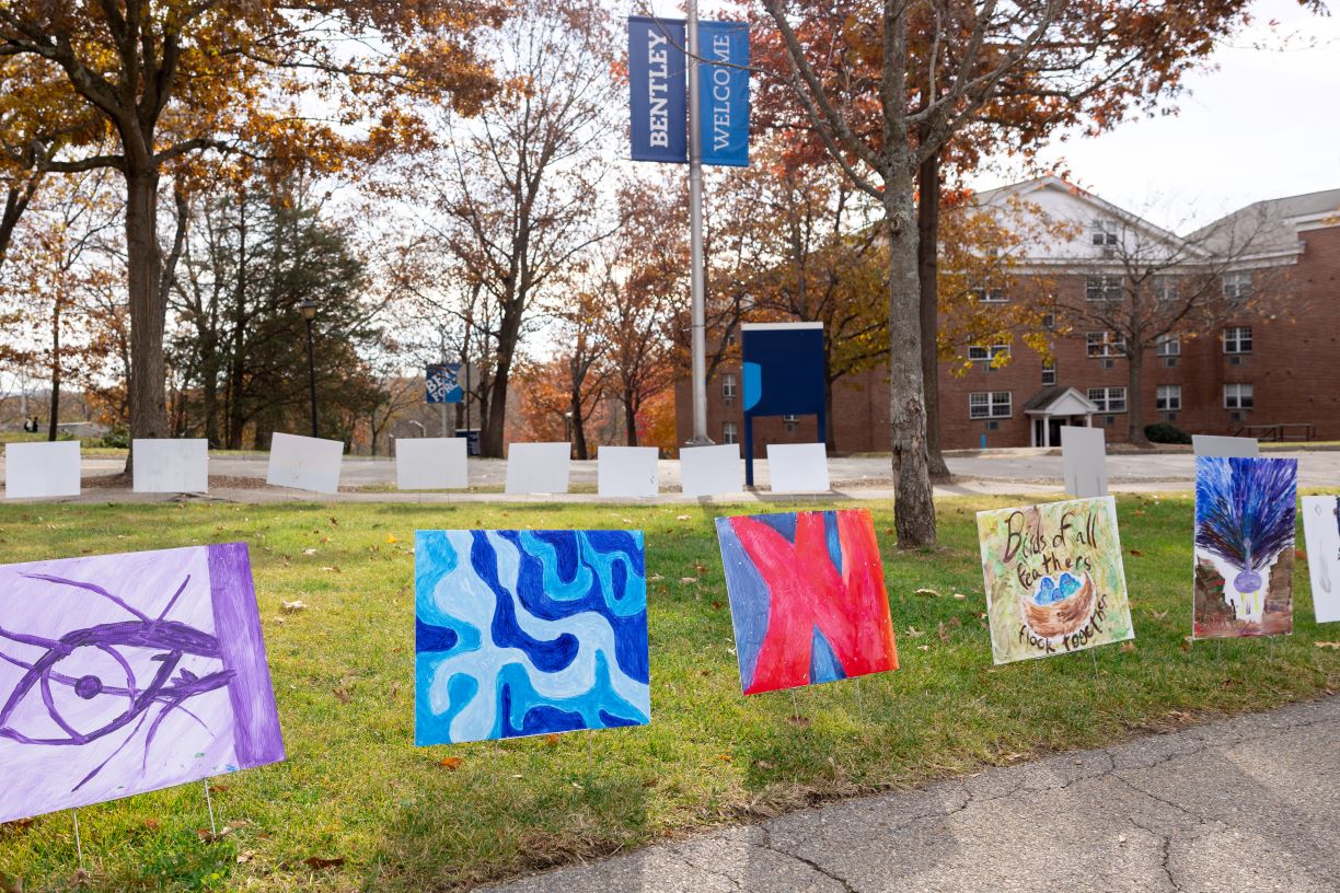 Paintings by Bentley students displayed on the green space