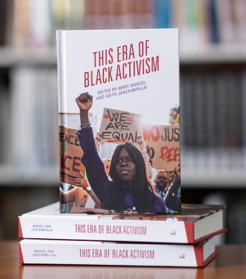 Cover of "This Era of Black Activism," featuring an image of a Black Lives Matter protest. In the foreground, a young Black woman stands with her fist raised into the air.