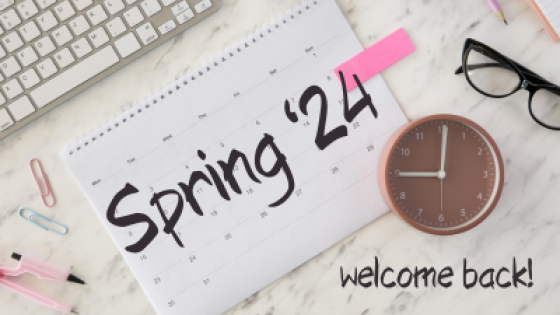 overhead view of top of a desk scattered with laptop, pens, paper clips, eyeglasses and clock. Message reads "Spring '24 welcome back"