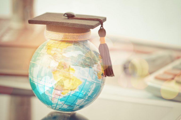 Globe with graduation cap on top