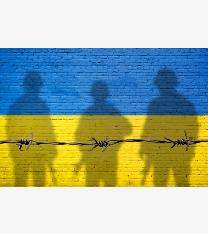Ukrainian flag with shadows of soldiers overlaying