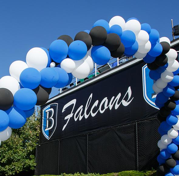 The entrance to the football field with balloons
