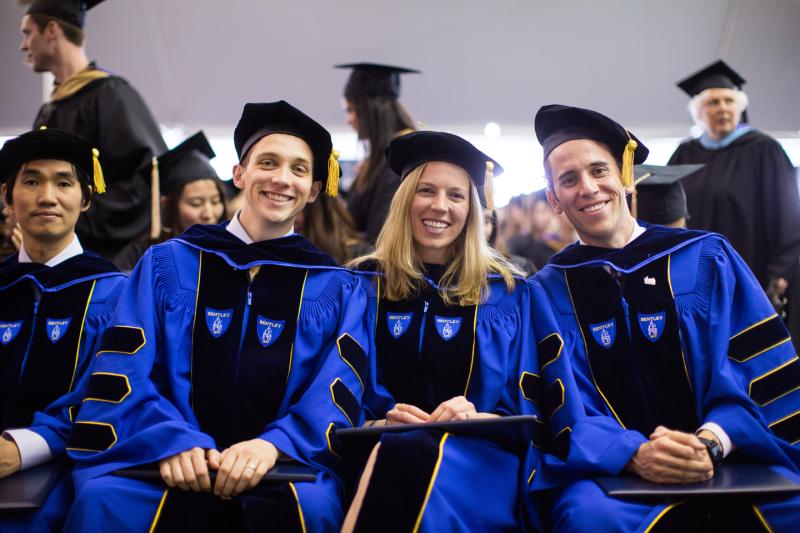 Three PhD students graduating from Bentley
