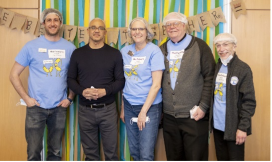 President Chrite and members of the Spiritual Life Center take a break from packaging meals. From left: Rev. Dr. Ian Mevorach; President E. LaBrent Chrite; Center director Rev. Dr. Robin Olson; Father Ted Brown; and Rabbi Jeffrey Foust.