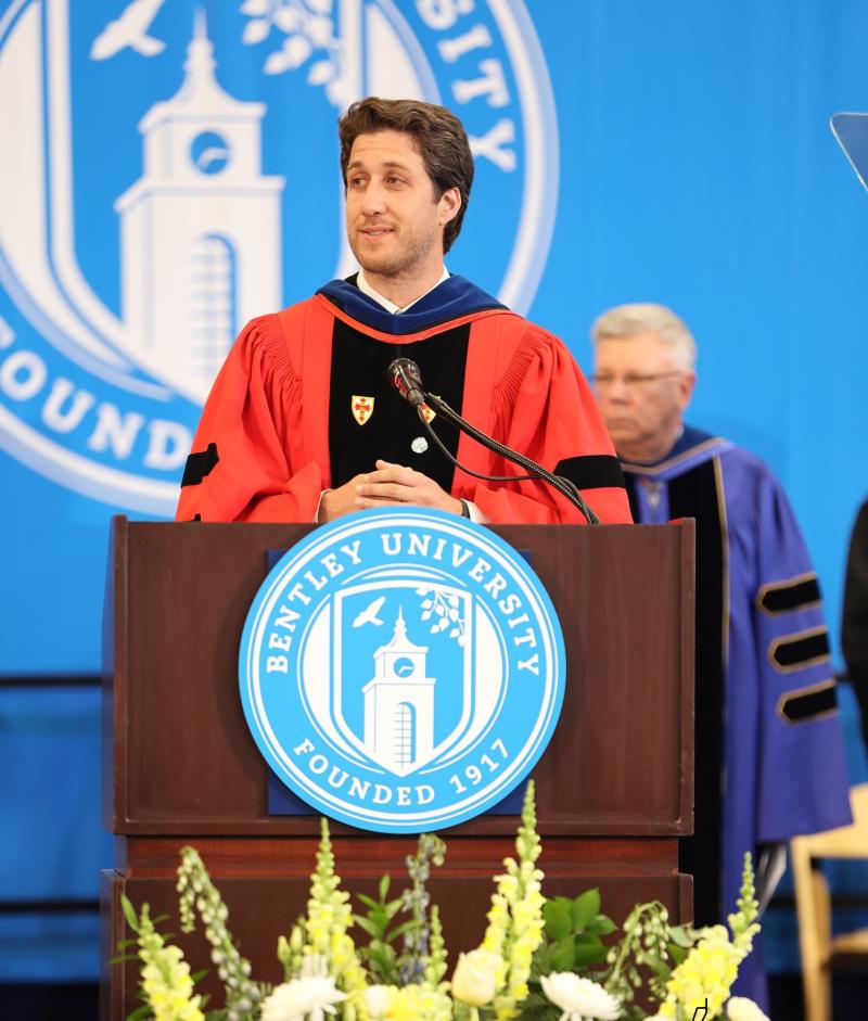 Ian Mevorach on stage at commencement