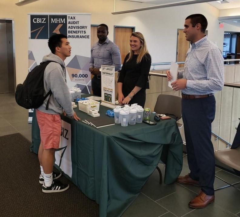 Student talking to Recruiters at an Info Table